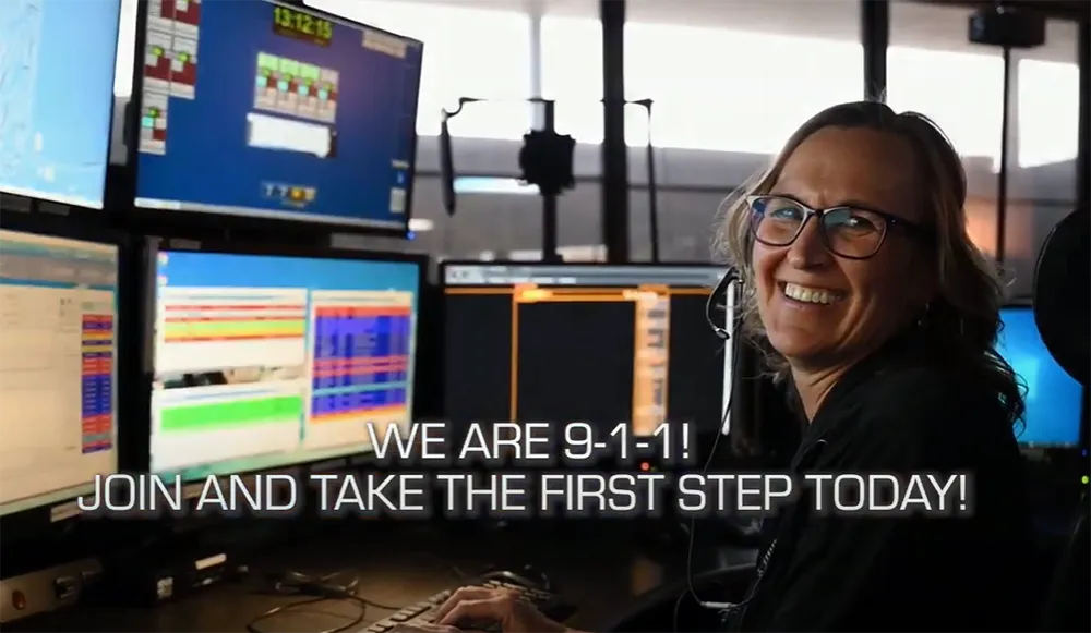 PRCC operator and computer screens with text saying "We are 9-1-1!"